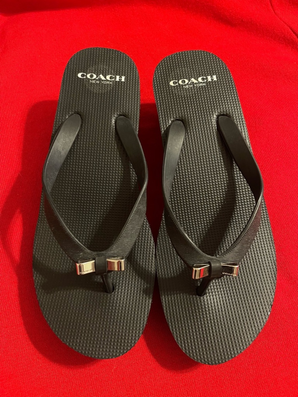 Coach Black Logo Thong Sandals with Metallic Bow Accent